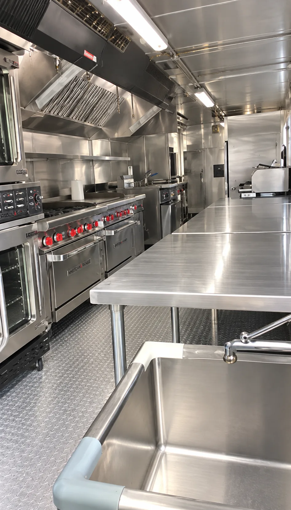Commercial cooking line and preparation surfaces inside a kitchen trailer